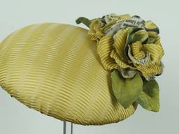 Textured gold silk button fascinator decorated with a trio of Italian silk roses and leaves.