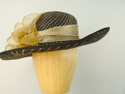 Cream and black panama straw hat with gold organza trim.