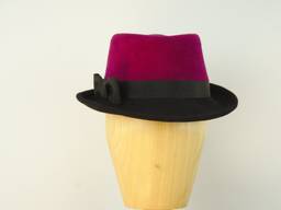 Striking velour trilby in magenta and black with ribbon trim.